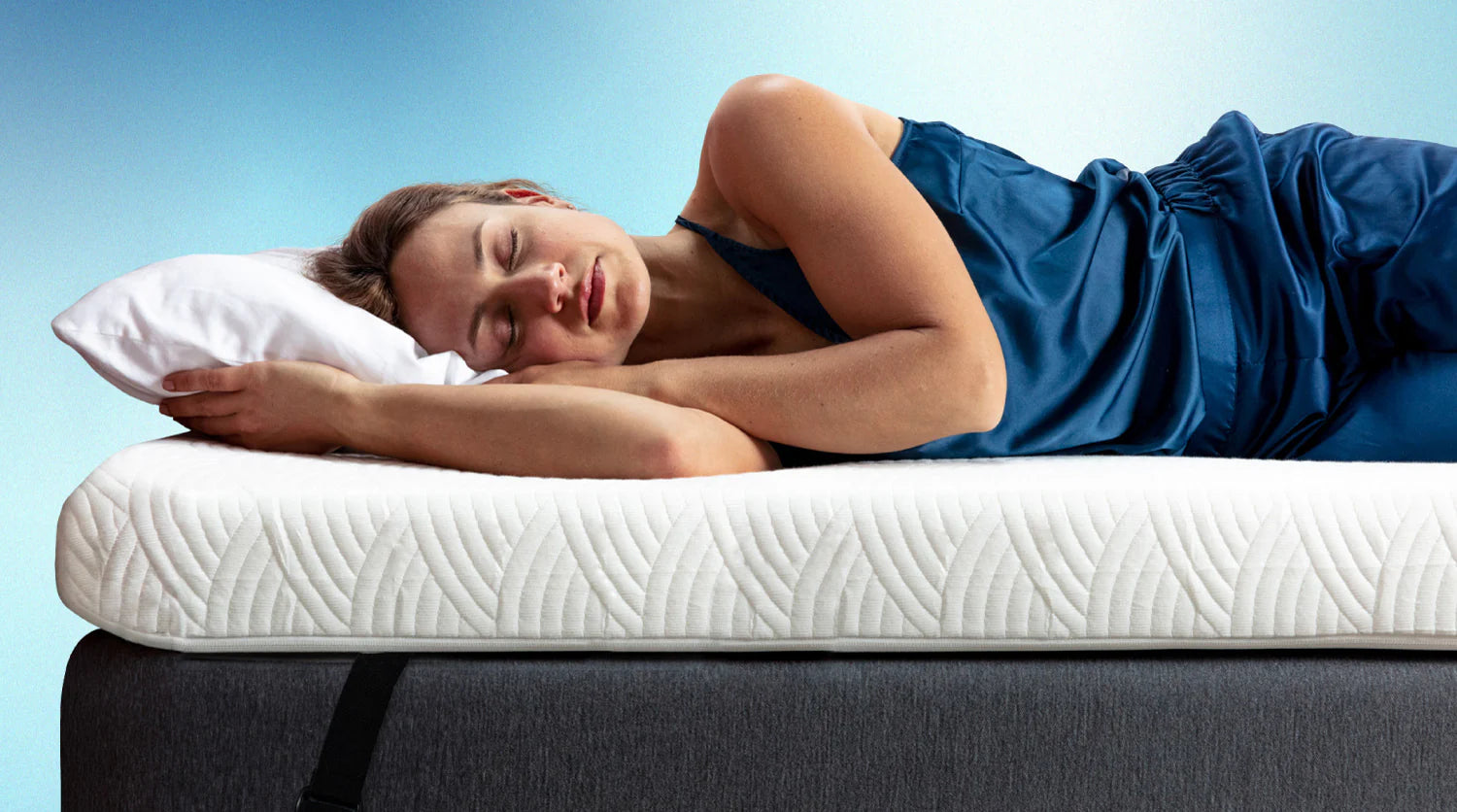 A stack of two 2-inch mattress toppers. One white and one blue.