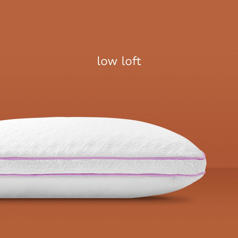 Low loft: White pillow with pink piping.