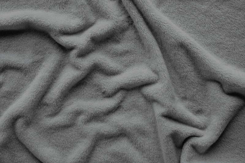 Close-up on fleece material in blanket.  Color is gray.