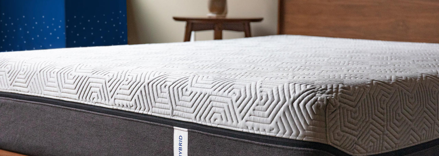 Edge hybrid mattress on a wooden bed frame