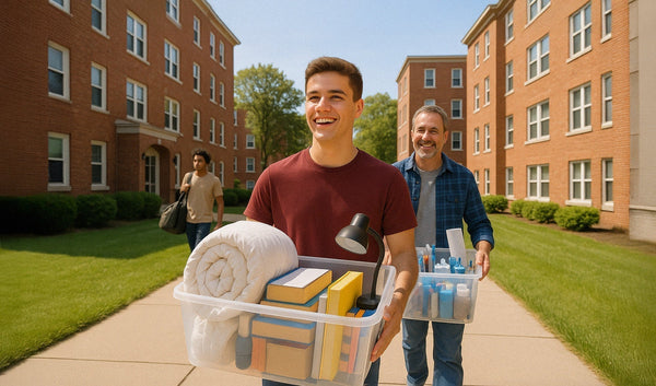 A freshman college student carrying moving into his dorm with his dad's help