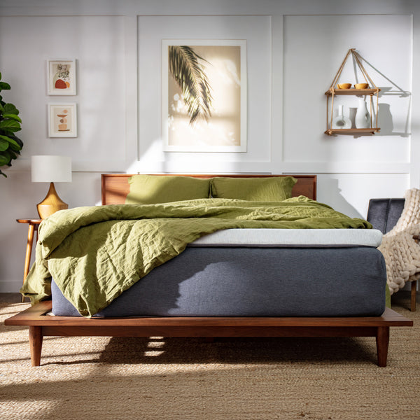 Thick gray mattress topper on a bed with green bedding (No Script, Alternate View)