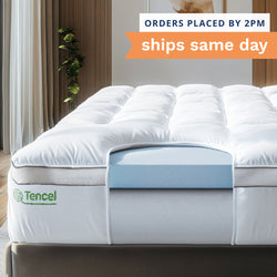 Orders placed by 2pm ships same day. Dual Layer Memory Foam + Pillow Top. Photo of a dual layer white mattress topper secured to a bed with an 18" deep pocket skirt.