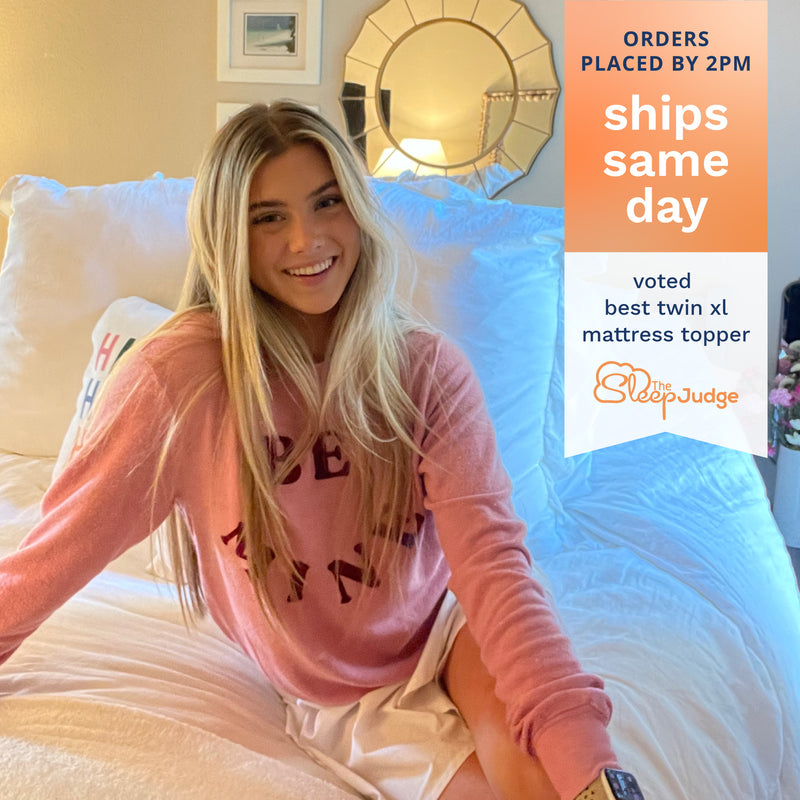 Orders placed by 2pm ships same day. Voted Best Twin XL Mattress Topper by The Sleep Judge. Photo of a college student smiling and sitting on her white Serene Hybrid mattress topper.