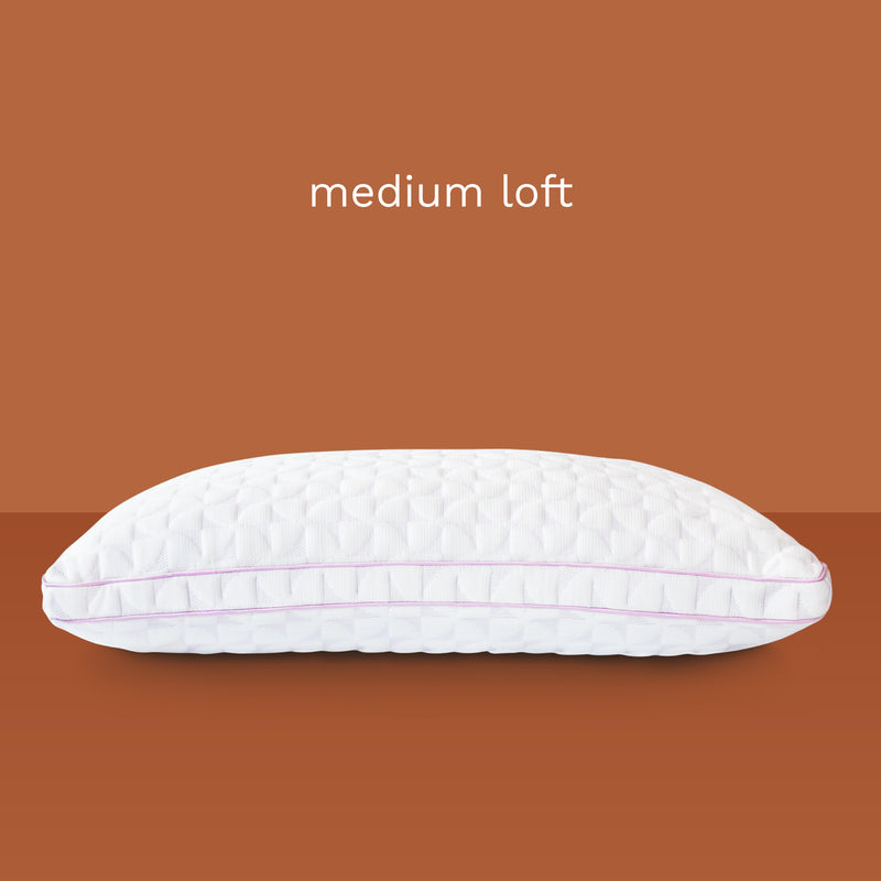 Medium loft: photo of a thick white pillow with pink piping