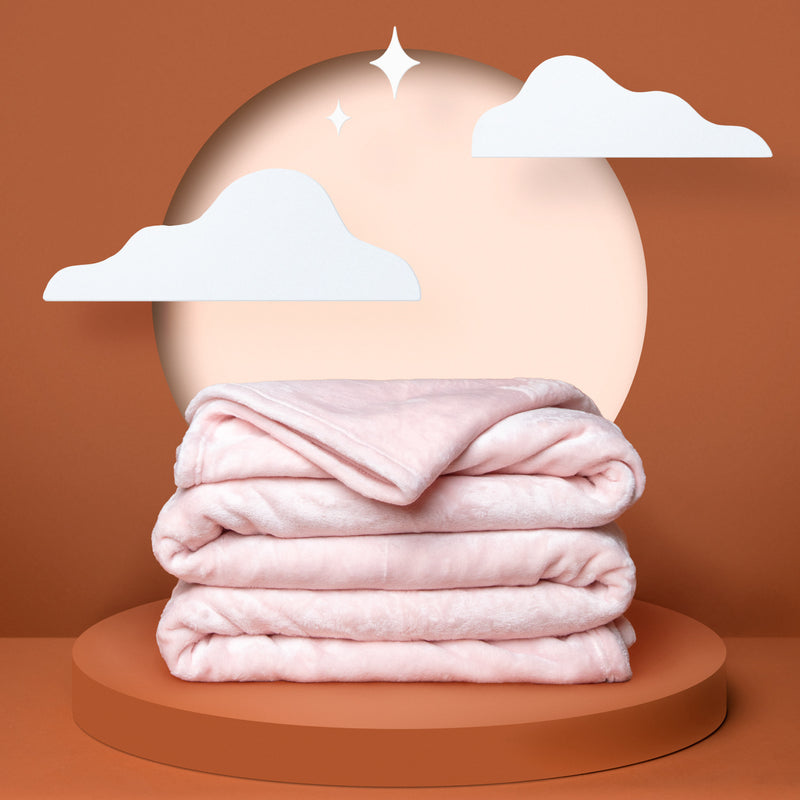 Folded pink fleece blanket.