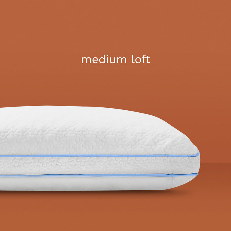 Medium Loft: White pillow with light blue piping.