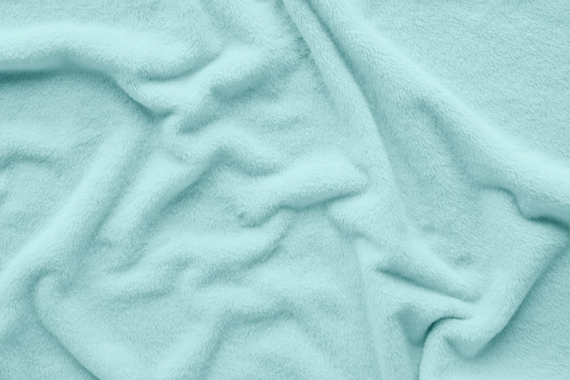 Close up of fleece material in aqua blanket