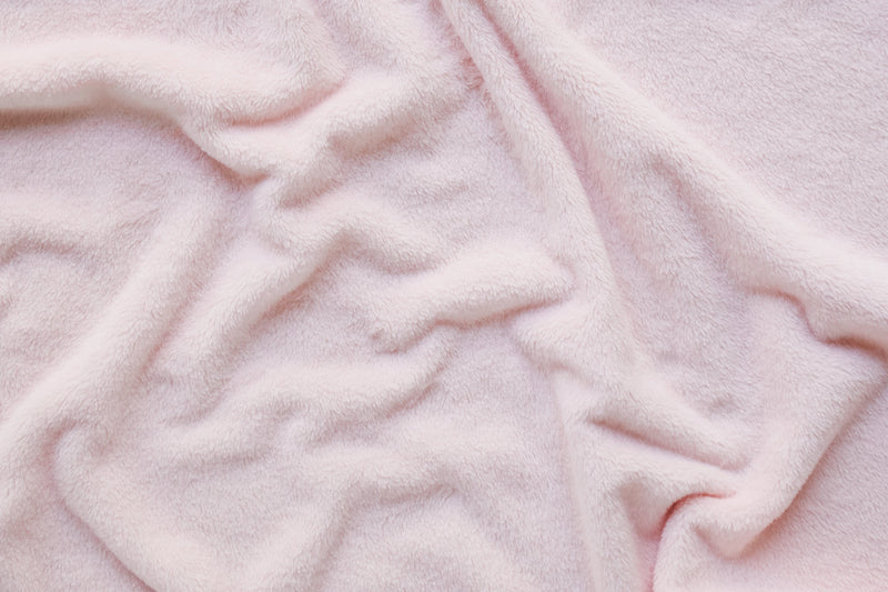 Close up of fleece material in pink blanket